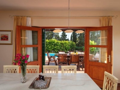 View from the dining room to the terrace and private outdoor pool
