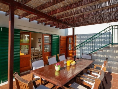 Covered outdoor dining table