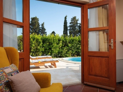 Open French doors and access to the pool